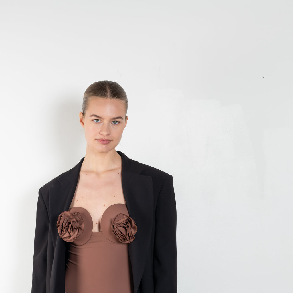 The Retro Bustier Swimsuit 01 by MAGDA BUTRYM is a retro one-piece swimsuit with a flower on each cup