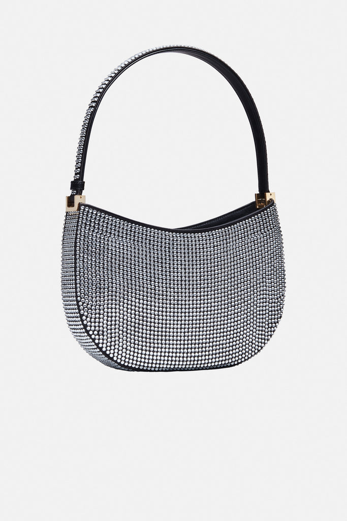 The Medium Vesna bag by Magda Butrym is a hobo bag with a classic yet trendy shape covered in crystals with a detachable signature strass brooch