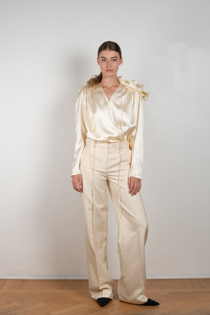 The Wide Leg Pants 08 by Magda Butrum are silk pants tailored with pleating, side pockets, belt loops, and a zip closure