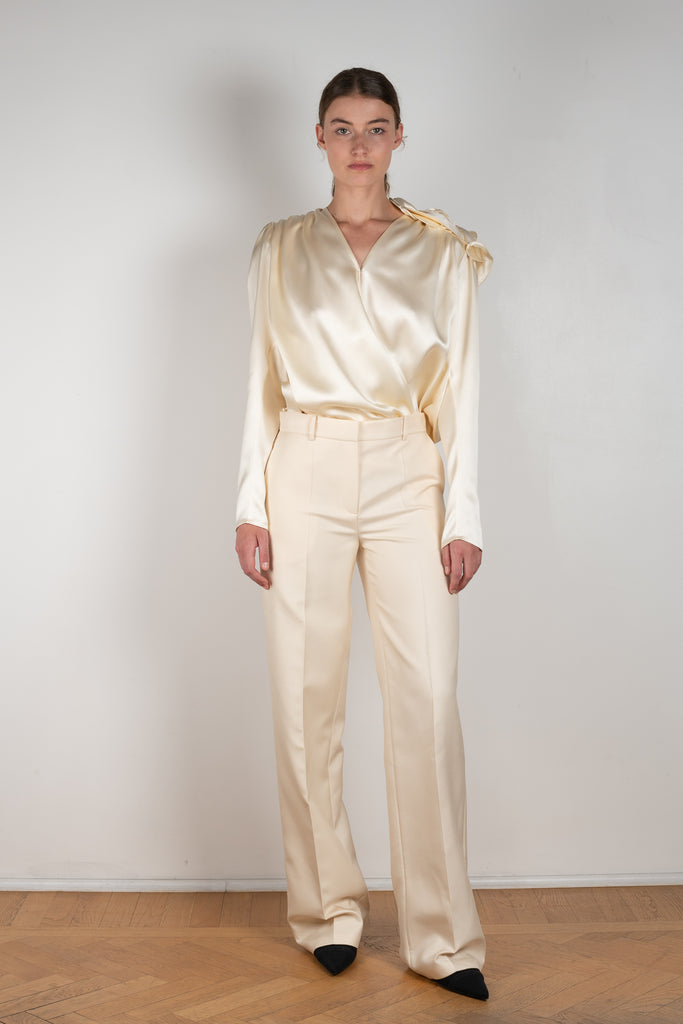 The Wide Leg Pants 08 by Magda Butrum are silk pants tailored with pleating, side pockets, belt loops, and a zip closure