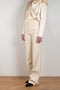 The Wide Leg Pants 08 by Magda Butrum are silk pants tailored with pleating, side pockets, belt loops, and a zip closure