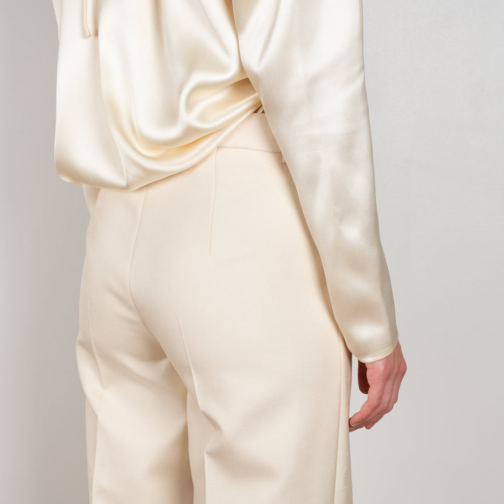 The Wide Leg Pants 08 by Magda Butrum are silk pants tailored with pleating, side pockets, belt loops, and a zip closure