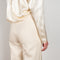 The Wide Leg Pants 08 by Magda Butrum are silk pants tailored with pleating, side pockets, belt loops, and a zip closure