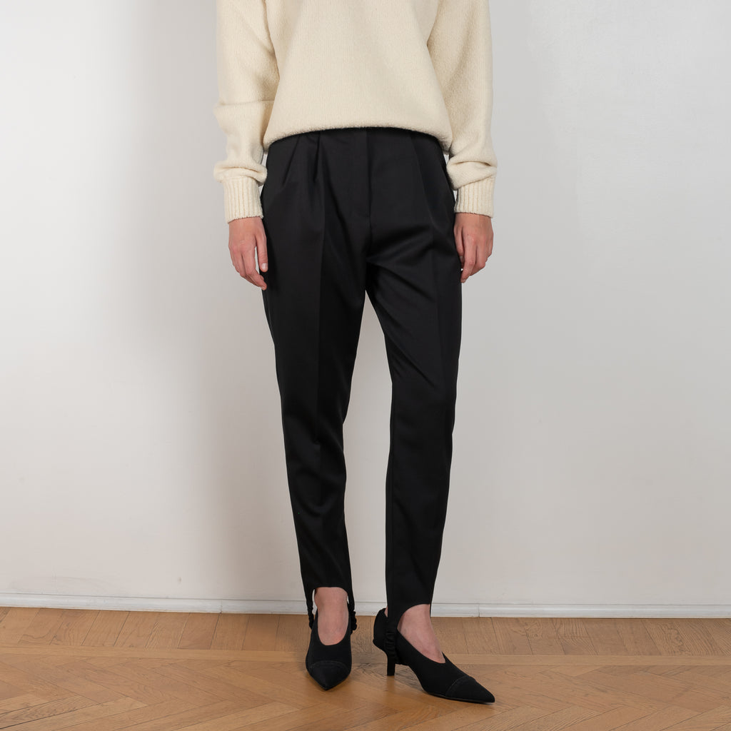 The Wool Stirrup Pants 01 by Magda Butrym is a classic wool skinny trousers with stirrup leg fastenings at the ankle