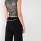 The Knit Chain Pants by Paco Rabanne is a signature knitted trouser with a straight leg and integrated chain belt