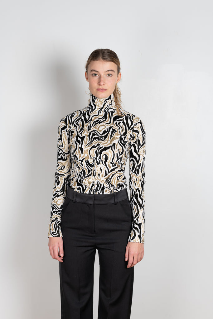 The turtleneck top by Paco Rabanne is a structured jacquard top in a black, gold and cream print