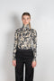 The turtleneck top by Paco Rabanne is a structured jacquard top in a black, gold and cream print