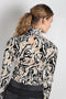 The turtleneck top by Paco Rabanne is a structured jacquard top in a black, gold and cream print