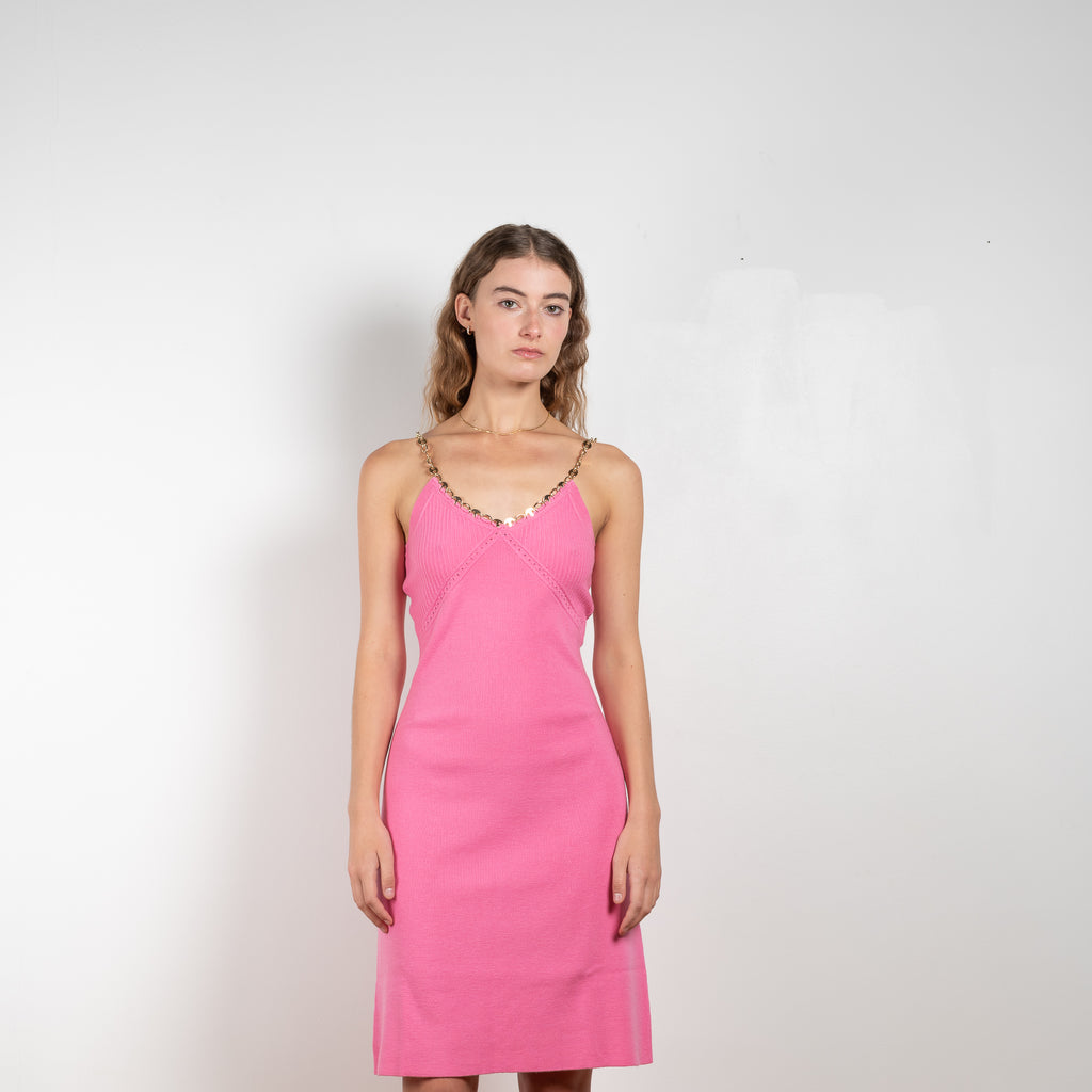 The Wool Chain Dress by Paco Rabanne is a bright pink wool dress with a chain collar in a soft merino wool