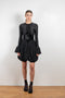 The Velvet Panel Mini Dress by Paco Rabanne is a short dress with a velvet panel, a puffed skirt and long flared sleeves