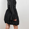 The Velvet Panel Mini Dress by Paco Rabanne is a short dress with a velvet panel, a puffed skirt and long flared sleeves