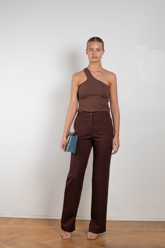 The Ellis Trousers by Rejina Pyo is a high waisted suiting trouser with a straight leg and signature button in a wool twill blend