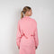 The Jolene Top by Rejina Pyo is a loose top with long sleeves and a fabric overlay scarf detail in a pink fluid viscose