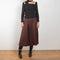 The Malia Skirt by Rejina Pyo is a high waisted a-line skirt with pleats in a fluid wool blend