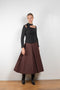 The Malia Skirt by Rejina Pyo is a high waisted a-line skirt with pleats in a fluid wool blend