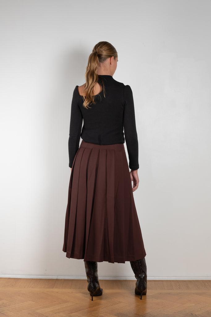 The Malia Skirt by Rejina Pyo is a high waisted a-line skirt with pleats in a fluid wool blend