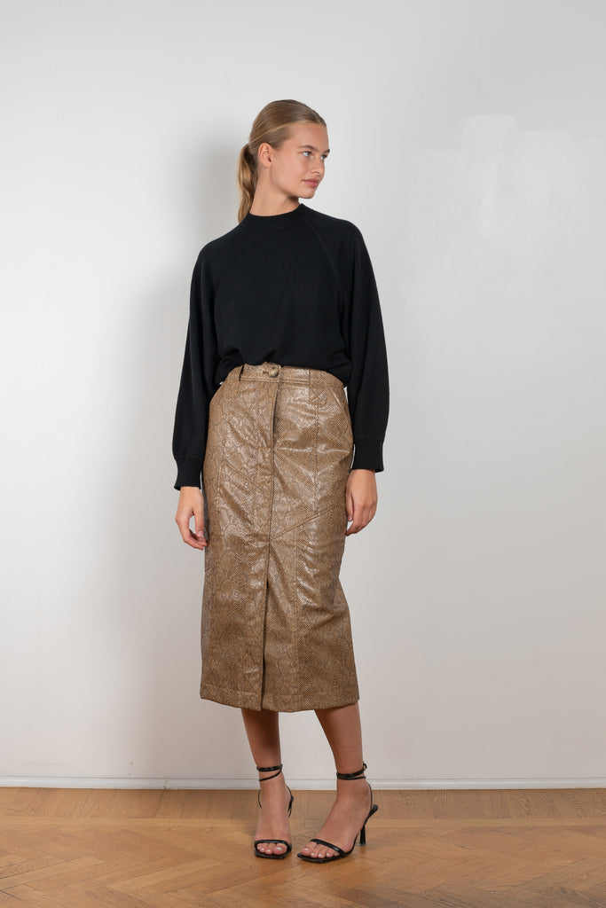 The Riley Skirt by Rejina Pyo is a high waisted pencil skirt with a front slit in a snakeskin faux leather