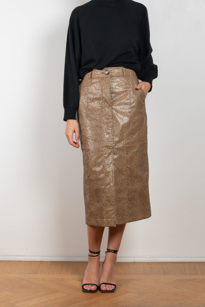 The Riley Skirt by Rejina Pyo is a high waisted pencil skirt with a front slit in a snakeskin faux leather