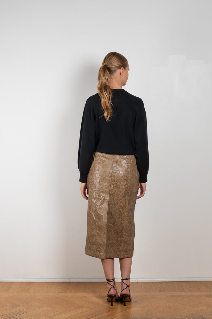 The Riley Skirt by Rejina Pyo is a high waisted pencil skirt with a front slit in a snakeskin faux leather