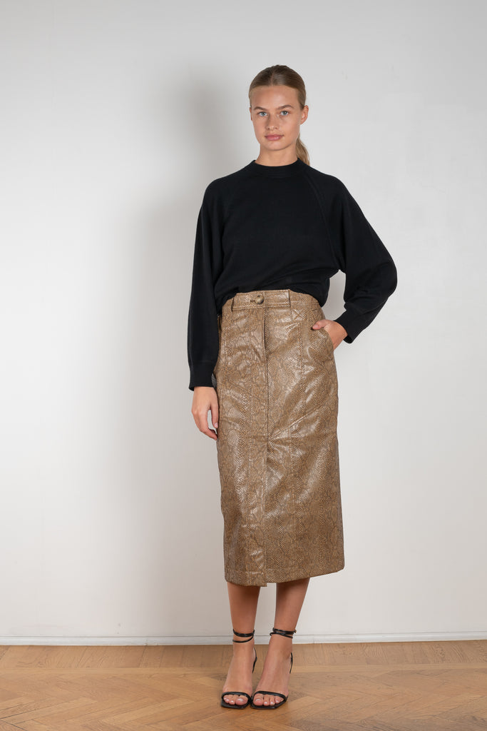 The Riley Skirt by Rejina Pyo is a high waisted pencil skirt with a front slit in a snakeskin faux leather