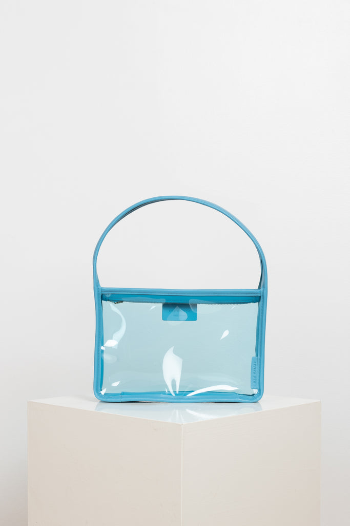 The Mini Lois Bag by Rejina Pyo is a transparent rectangular mini-bag that can carry all your essentials