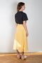 The Rocco Skirt by Rejina Pyo is a mid-length a-line shaped skirt with signature seasonal hand-crafted buttons 