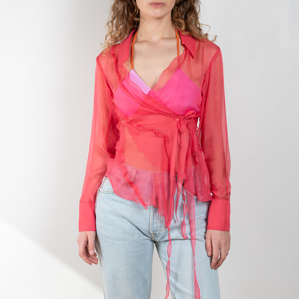 The Yuri Shirt by Rejina Pyo is a silk chiffon wrap top with 2 exaggerated tie fastenings, long sleeves and an asymmetrical back