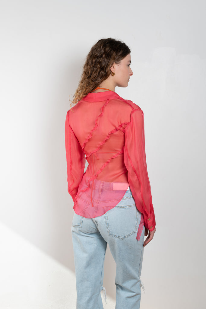 The Yuri Shirt by Rejina Pyo is a silk chiffon wrap top with 2 exaggerated tie fastenings, long sleeves and an asymmetrical back