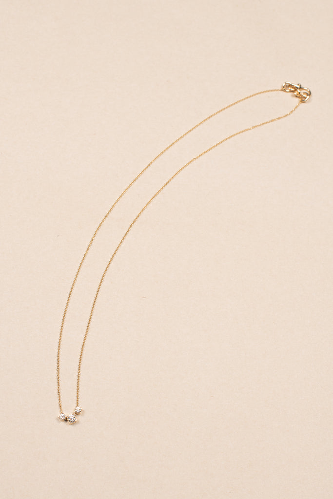 The Orangerie Trois Necklace by Sophie Bille Brahe has three petite diamonds that sit loose on the delicate gold chain allowing them to move elegantly as the necklace is worn