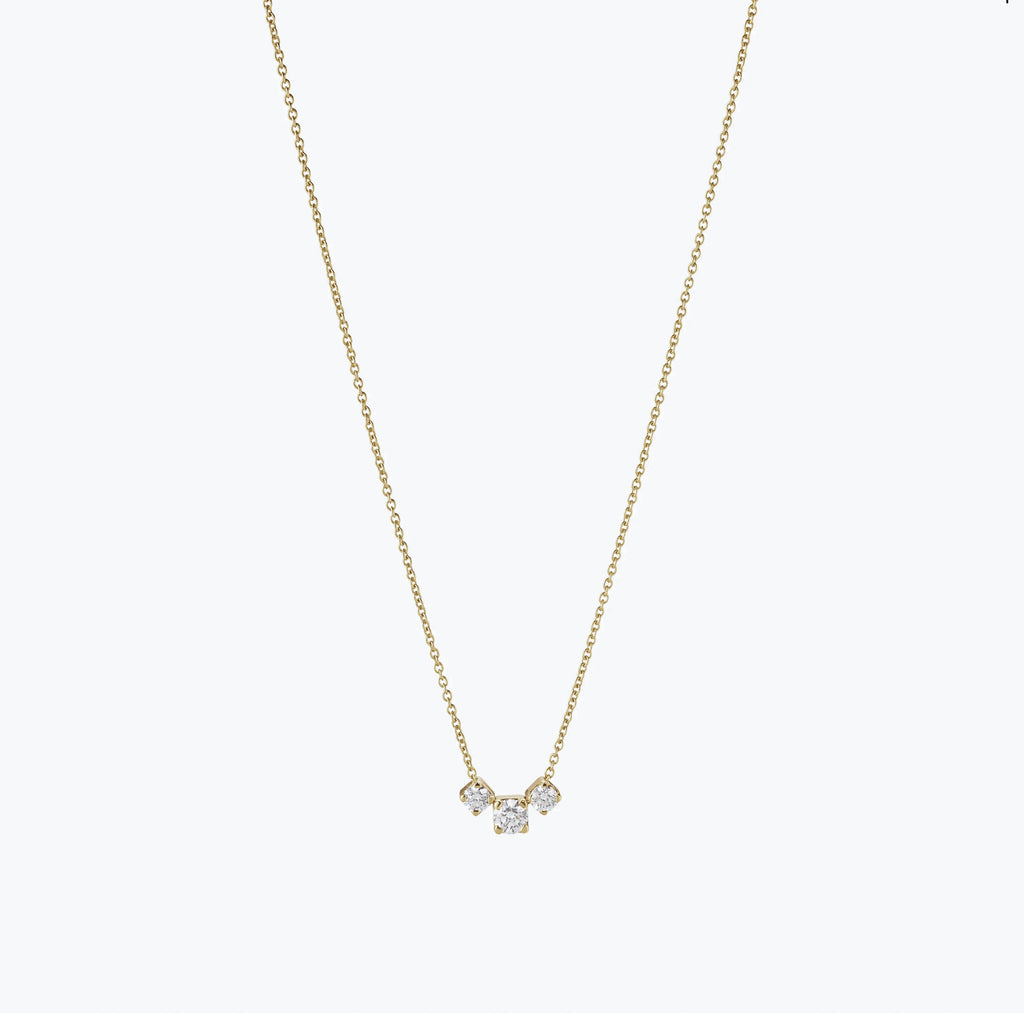 The Orangerie Trois Necklace by Sophie Bille Brahe has three petite diamonds that sit loose on the delicate gold chain allowing them to move elegantly as the necklace is worn