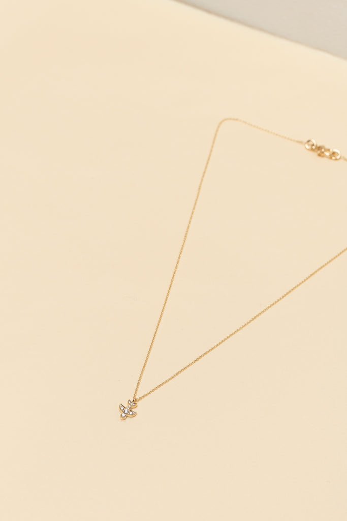 The Petite Matisse Necklace by Sophie Bille Brahe is a fine 18Kt Gold necklace with diamonds set in a dove shaped charm inspired by the artist Henri Matisse