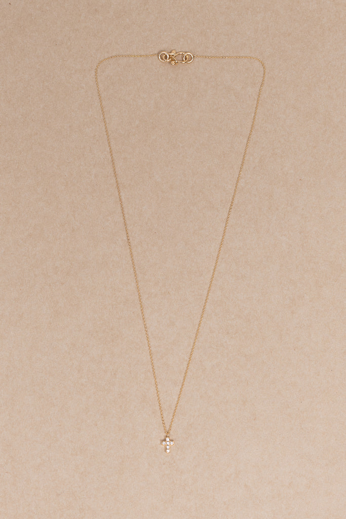 The Giulietta Necklace by Sophie Bille Brahe is a delicate necklace in 18K yellow gold and five 0.06 carat Top Wesselton VVS diamonds set in a cross shape