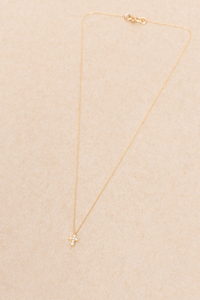 The Giulietta Necklace by Sophie Bille Brahe is a delicate necklace in 18K yellow gold and five 0.06 carat Top Wesselton VVS diamonds set in a cross shape