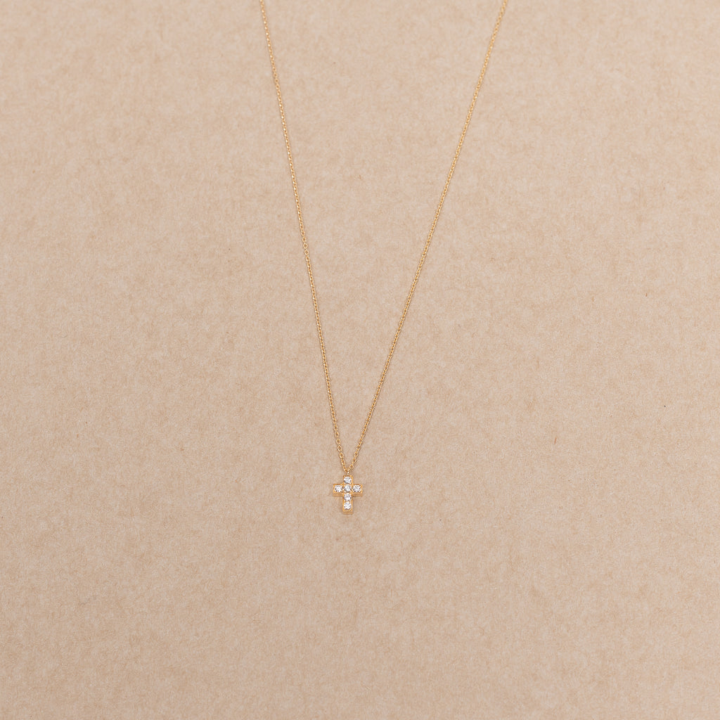 The Giulietta Necklace by Sophie Bille Brahe is a delicate necklace in 18K yellow gold and five 0.06 carat Top Wesselton VVS diamonds set in a cross shape