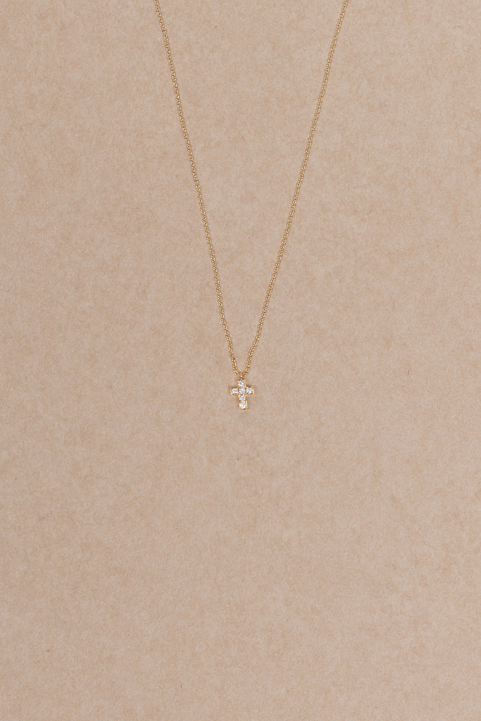 The Giulietta Necklace by Sophie Bille Brahe is a delicate necklace in 18K yellow gold and five 0.06 carat Top Wesselton VVS diamonds set in a cross shape