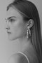 The Fontaine Nuit Earring by Sophie Bille Brahe is a statement drop earring with white freshwater pearls varying in size