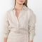 The Fiona Dress by Xirena is a soft linen tie wrap mini dress