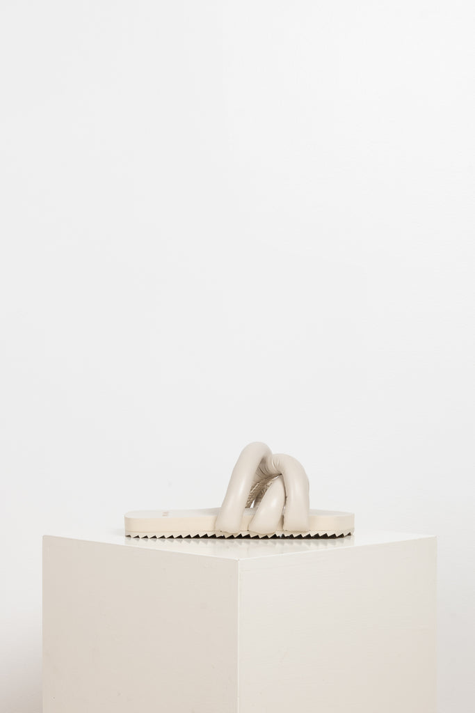 The Tyre Slides by Yume Yume are relaxed slides with chunky straps all over the front foot in beige